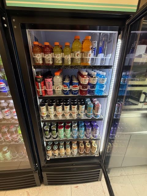 Cooler stocked with Gatorade, energy drinks, and water