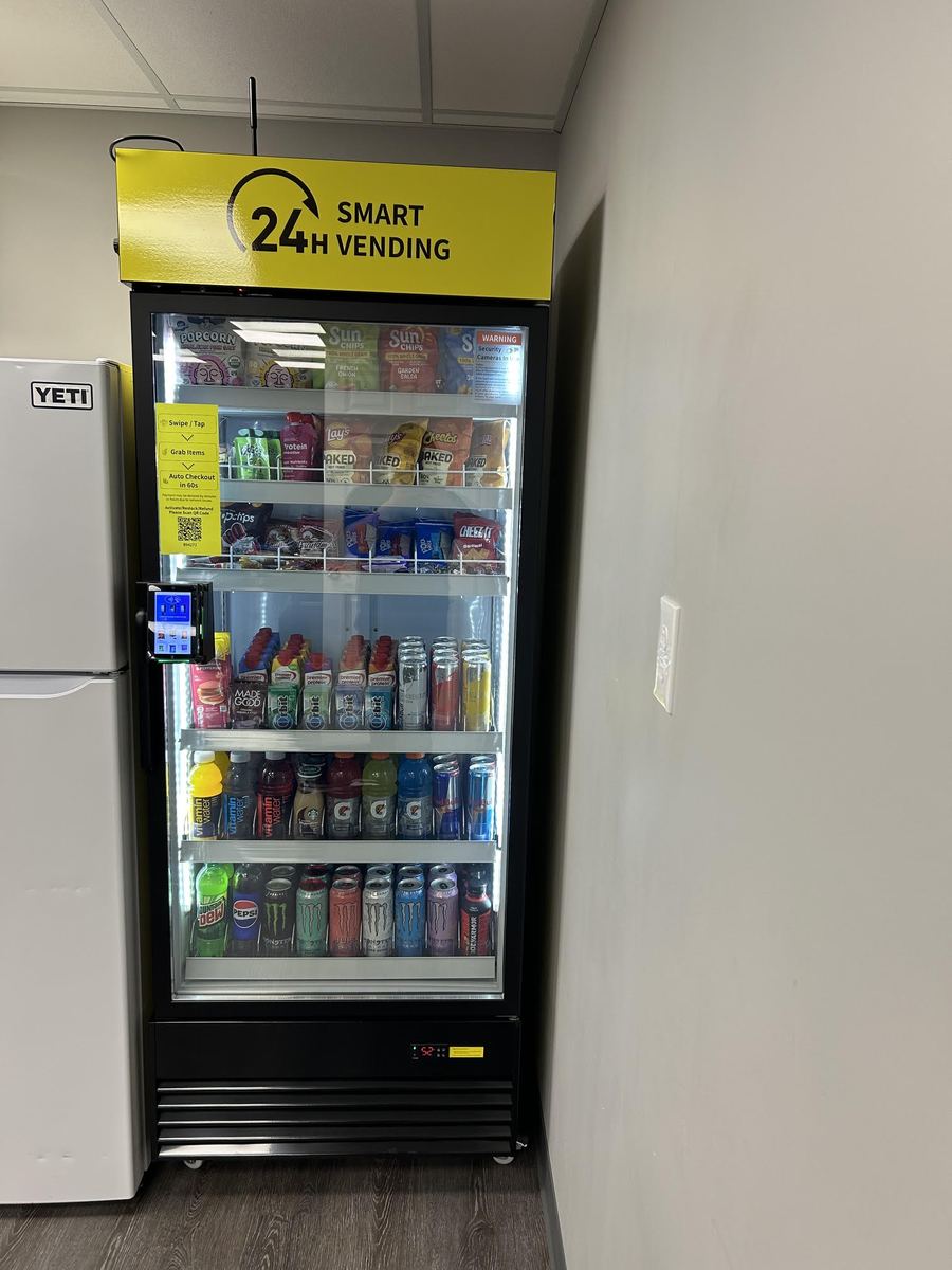 BMV smart vending cooler stocked with drinks, snacks, and meals